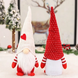 Set of two festive Christmas gnome plush dolls with knit hats and red-white striped clothes