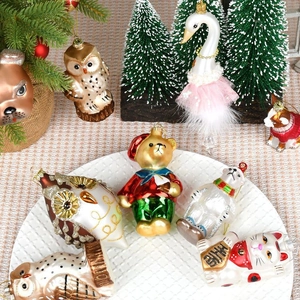 Festive painted glass animal ornaments including owl and bear for Christmas tree decor