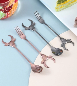 Detail view of 304 stainless steel spoons and forks with creative bull head handles