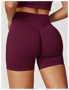 Detail of burgundy high waist seamless yoga shorts with scrunch butt lifting effect
