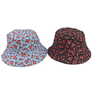 Detail view showing blue and black floral bucket hats with vibrant red flower prints