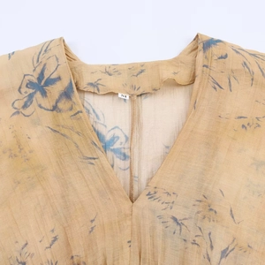 Women's V-neck floral print slim-fit top in ginger yellow with pleated fabric texture