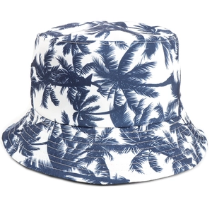 Reversible white cotton bucket hat with navy blue tropical coconut tree leaf print pattern