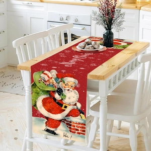 Christmas table runner with Santa Claus and Merry Christmas text on wooden dining table