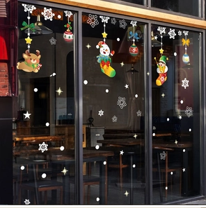 Detail view of festive Christmas elk and snowman stickers on a shop glass window