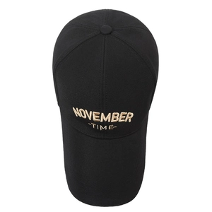 Classic black cotton baseball cap featuring gold November 3D embroidery on a white backdrop