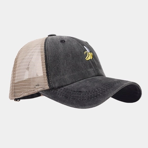 Vintage washed denim trucker hat with yellow banana embroidery and mesh back panels