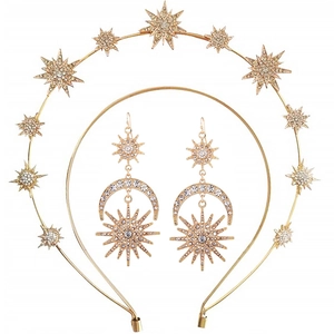 Detailed view of gold star headband and crescent earrings set with sparkling rhinestones