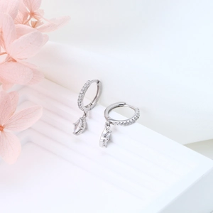 Close-up of S925 sterling silver hoop earrings with marquise-cut zircon pendants on stand