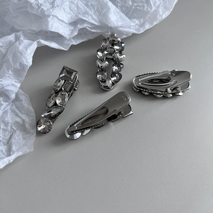 Metallic silver-grey hair clips set with crystals and polished heart-shaped duckbill pins