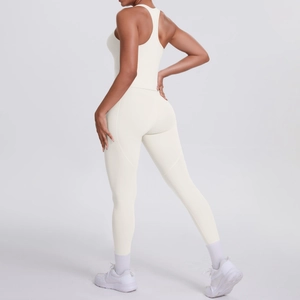 Detail view of high-waist cream yoga leggings showing ergonomic stitching and body-shaping fit