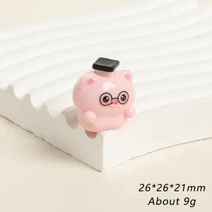Cute pink resin pig figurine wearing a graduation cap and glasses, size 26x26x21mm