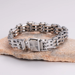 Rugged silver stainless steel motorcycle chain bracelet for men on a natural stone base