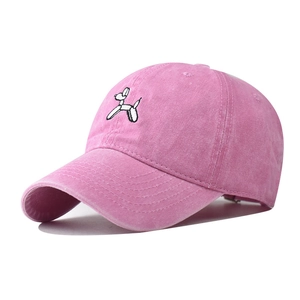 Detail shot of pink washed cotton baseball cap with robotic balloon dog embroidery
