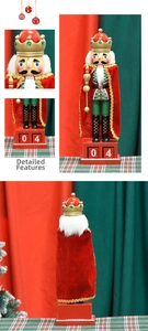 Detail of wooden nutcracker calendar with red velvet cloak and movable date blocks