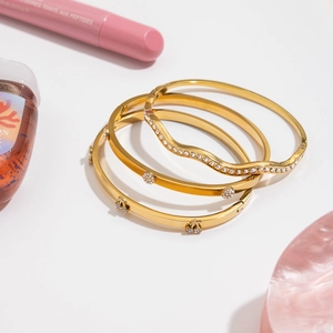 Three-piece 18K gold plated stainless steel wave bracelets with sparkling zircon stones