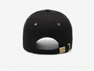 Detail view of cotton baseball cap back with adjustable brass buckle and embroidery