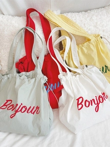 Korean style drawstring canvas shoulder bag featuring Bonjour letter print in four colors
