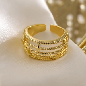 18K gold plated hollow geometric ring featuring stacked layers and mini star charms