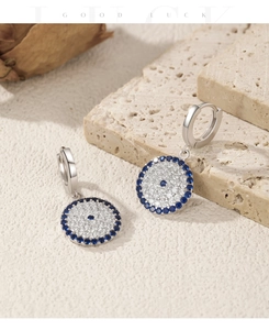 Detailed close-up of S925 sterling silver evil eye earrings with blue and white zircons
