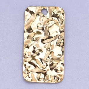 Macro shot of 304 stainless steel golden rectangular pendant with embossed water ripple texture