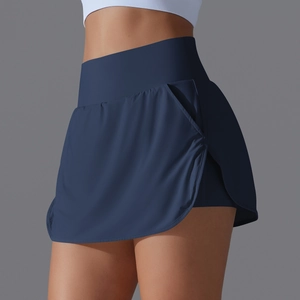 Close-up of navy blue high-waisted tennis skirt with side pocket and built-in shorts