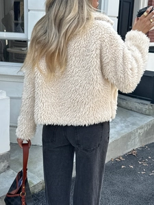 Elegant women's cream faux fur coat with long sleeves and fluffy texture back view
