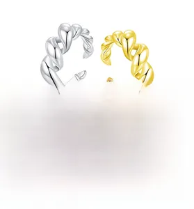 Detail of S925 sterling silver stamp on minimalist gold and silver twisted rings