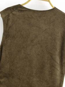Detail view of brown faux suede sleeveless top with soft fabric texture on gold hanger