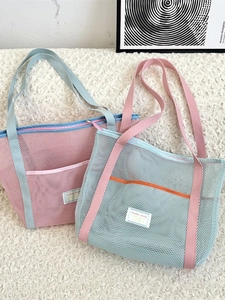 Mesh beach tote bag with pink and blue contrast design and spacious external pocket
