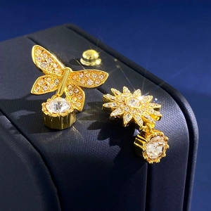 Asymmetric gold butterfly and star stud earrings with sparkling crystal tassels
