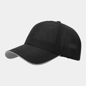 Detailed macro view of black mesh fabric on a breathable outdoor sports baseball cap