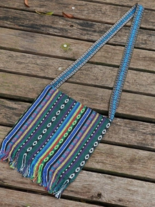 Ethnic bohemian style crossbody bag with geometric patterns and colorful tassels