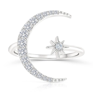 Macro detail of silver S925 moon and star ring featuring pavé-set shimmering cubic zirconia