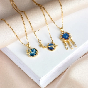 Golden planet necklaces with deep blue starry stones and sparkling zircon pendants