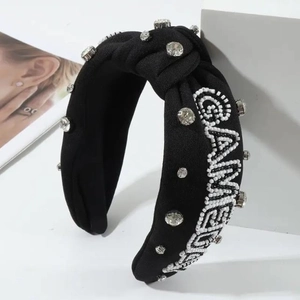 Detail view of black knotted headband with rhinestones and beaded GAME DAY text decor