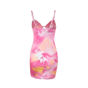 Detail of pink and orange artistic tie-dye pattern on slim fit mini dress fabric