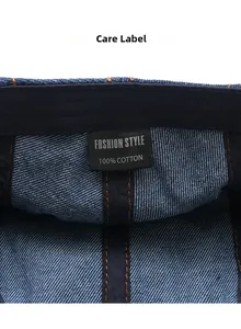Detail shot of blue denim hat care label showing 100% cotton material and stitching
