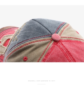 Detail of vintage washed baseball cap showing patchwork stitching and distressed edges