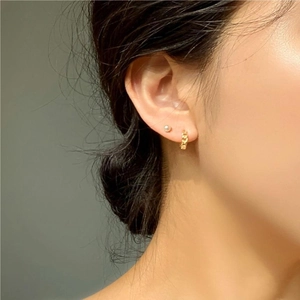 925 sterling silver gold chain earrings and small hoops set worn by a female model
