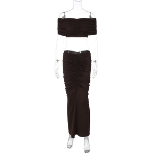 Detailed texture of dark brown two-piece set with micro-pleated fabric and slim-fit cut