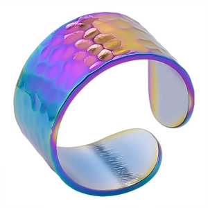 Macro shot of 304 stainless steel ring with rainbow fish scale pattern and hammer texture