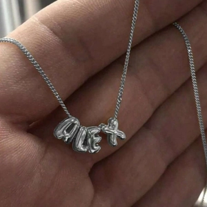 Detail of silver 3D balloon bubble letter pendant personalized with the name ALEX