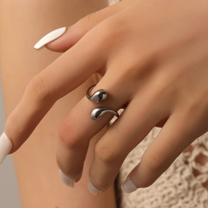 Silver liquid metal style open ring with double water drop design on model's hand