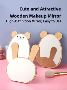 Close-up of stacked bear and bunny shaped wooden vanity mirrors with clear glass