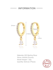 Macro detail of S925 sterling silver huggie earrings with sparkling pear-cut zircon drops