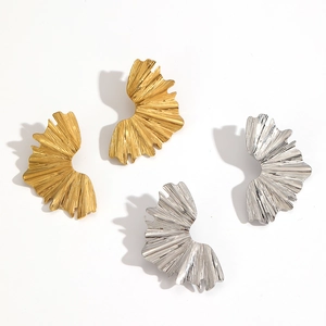Textured irregular leaf-shaped earrings in gold and silver finish on white background