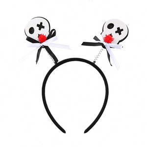 Halloween headband with skull decoration and red ribbon bows on a white background