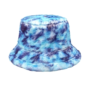 Detailed texture of blue-purple tie-dye faux fur on a warm autumn winter bucket hat