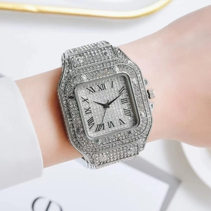 Macro shot of silver square quartz watch with rhinestones and Roman numerals